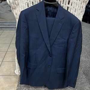 Jos. A. Bank Navy Pinstripe suit. Coat size 44 Long. Pants hemmed 30 length.